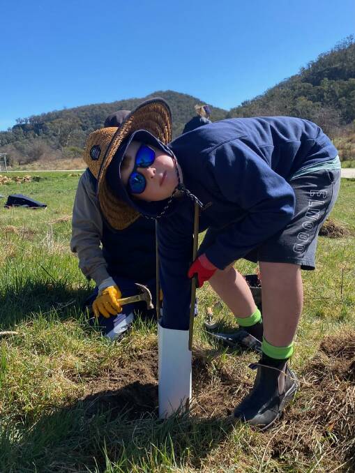 10-year-old Jack Lahiff was among civic minded volunteers of all ages who turned out for Landcare sponsored tree planting at the weekend.