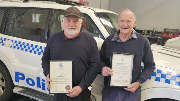 George Redding jnr and George Redding snr hold their statements of recognition for service to the community. Picture by Reidun Berntsen. 