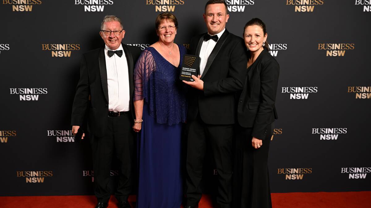 The Cluff family with their Excellence in large business award. Picture supplied.