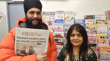 New managers of Portland Newsagency, Simrinjeet Singh and Sara Marriner with a print edition of the Lithgow Mercury. Picture by Reidun Berntsen. 
