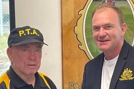 Jason Whitney is presented with his Australian blazer by Portland Touch Football Association founder Barry Fardell. Picture from Portland Touch Football Association Facebook page