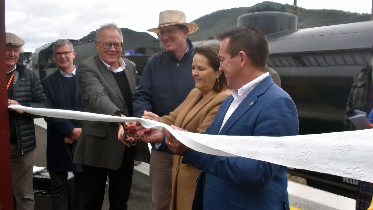 Anna Watson, Parliamentary Secretary for Regional Transport and Roads and Paul Toole, Member for Bathurst, cut the "ribbon" to declare the renewed station open. Photo Peter Bowditch