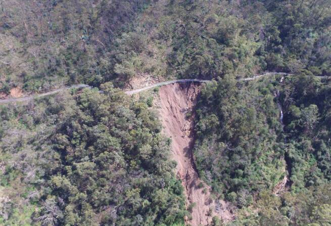 An aerial view shows the extent of the damage on the Five Mile section of Jenolan Caves Road. Picture from Transport for NSW.