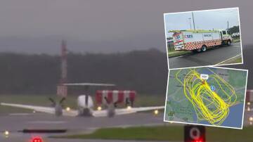 Main image of plane conducting wheels-up landing at Newcastle Airport. Picture by Nine News